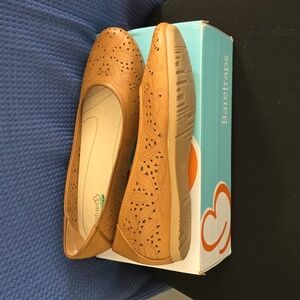 Bare traps slip on flats with memory foam insoles.